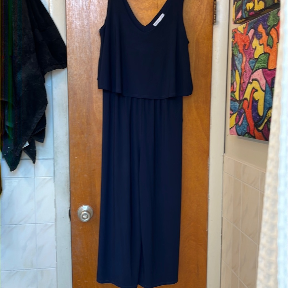 Navy jumpsuit. Comfortable and used. In good condition. Polyester mix.